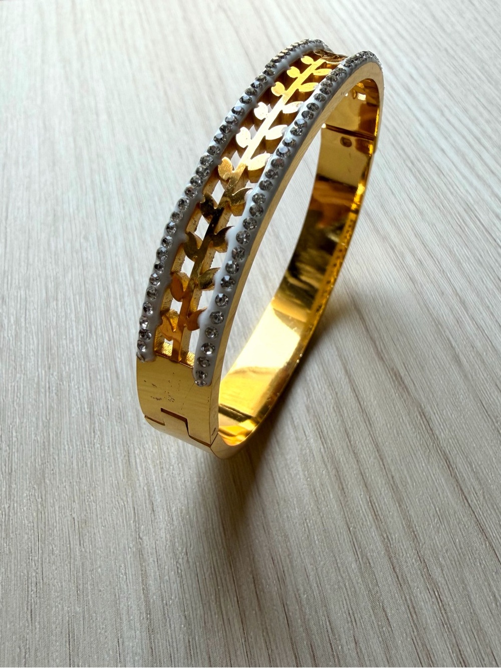 Gold Tone Leaf-Pattern Bangle Bracelet with Crystal Accents